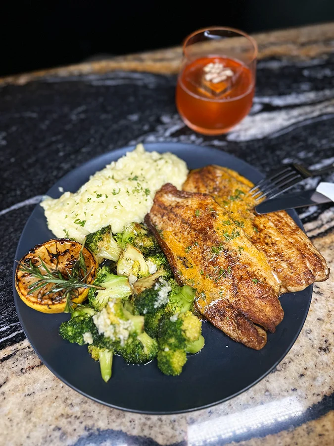 Blackened Stuffed Salmon with Cajun Sauce on Grits